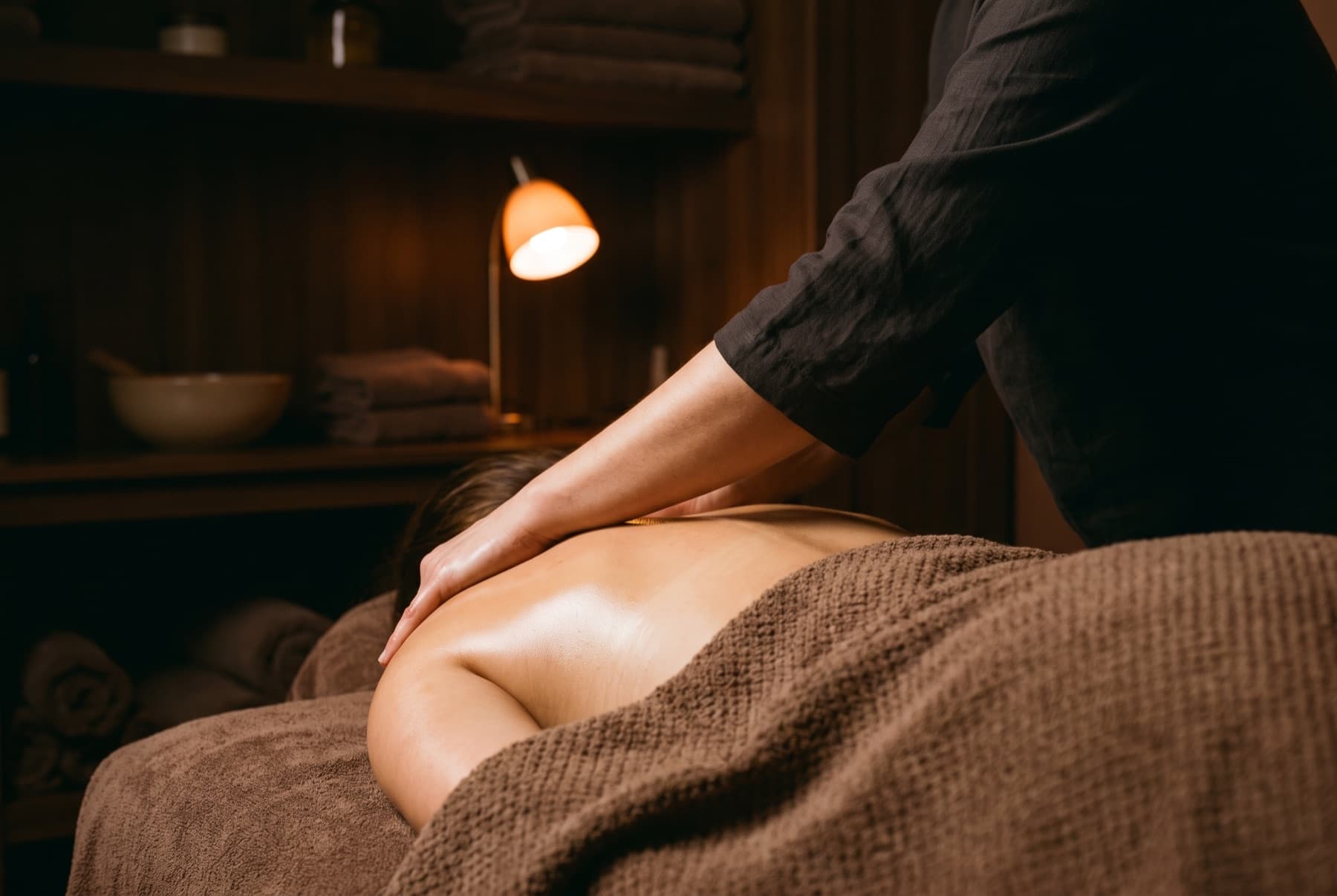 Deep tissue massage on a client's shoulders at a spa in Rawalpindi